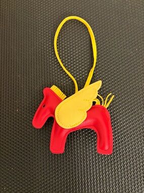 Yellow & Red Winged horse charm for your bag.